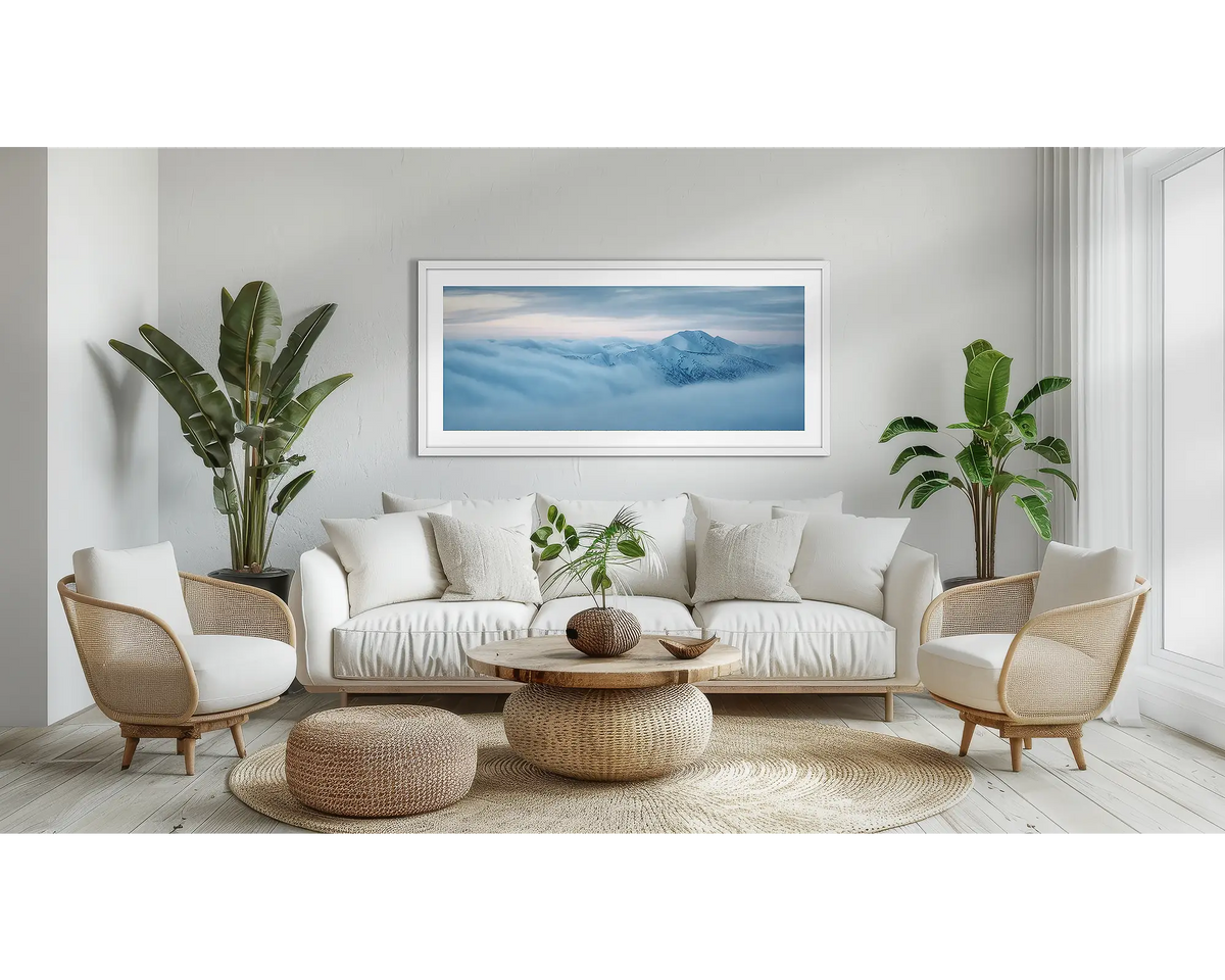 Above It All. Snow wall art in a white frame, hanging in a lounge room. 