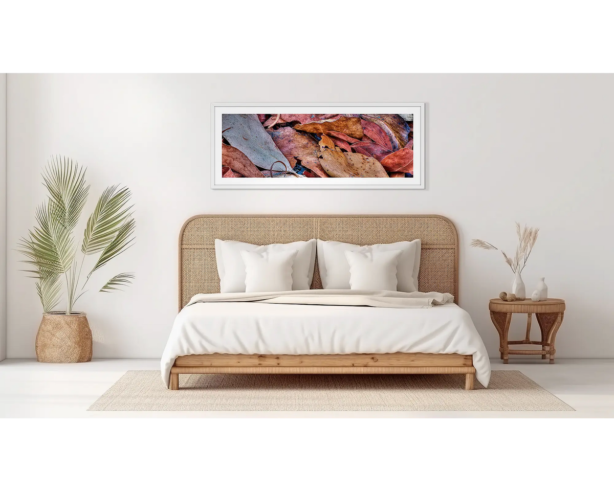 After The Fires. Abstract wall art in a white frame, on a bedroom wall. 