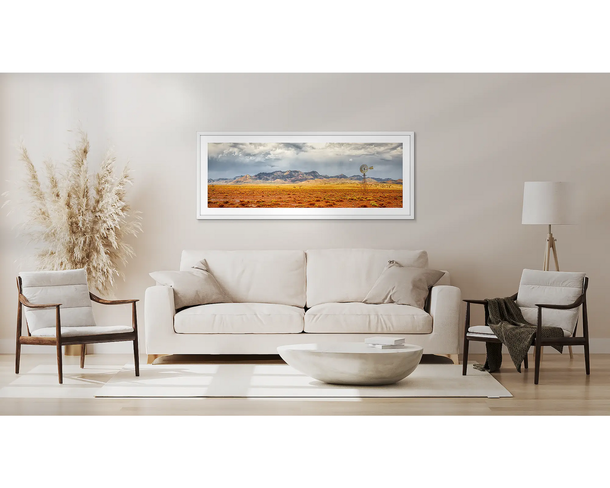 After The Rain. Flinders Ranges artwork, in a white frame, above a couch. 