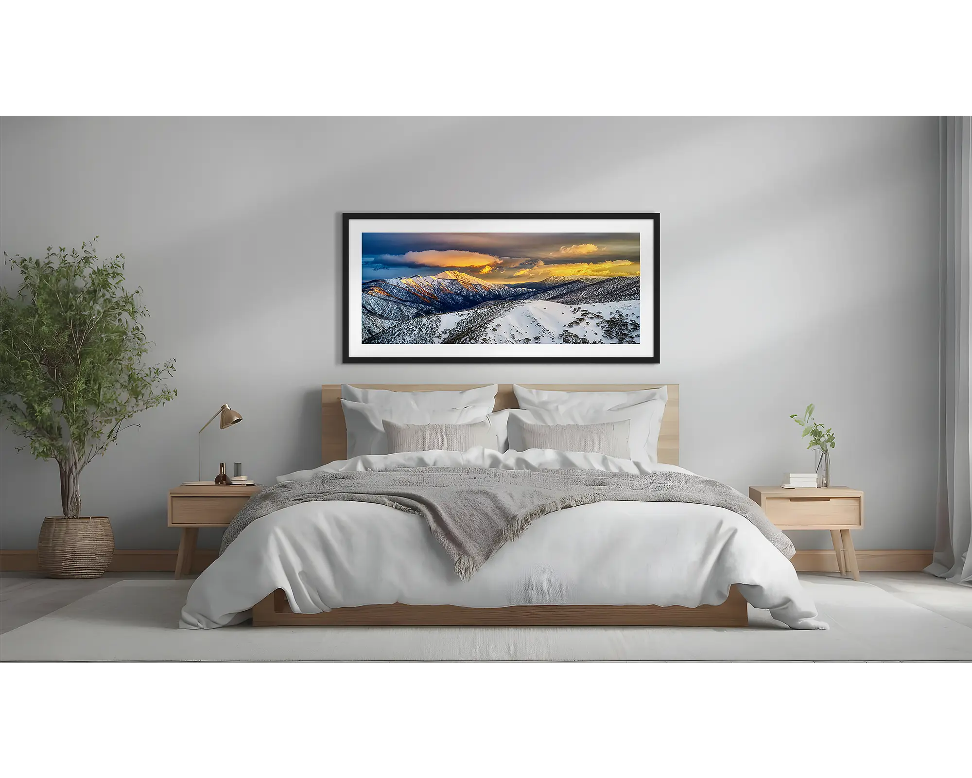 Alpine Magic. Winter snow sunrise wall art  in black frame above a bed.