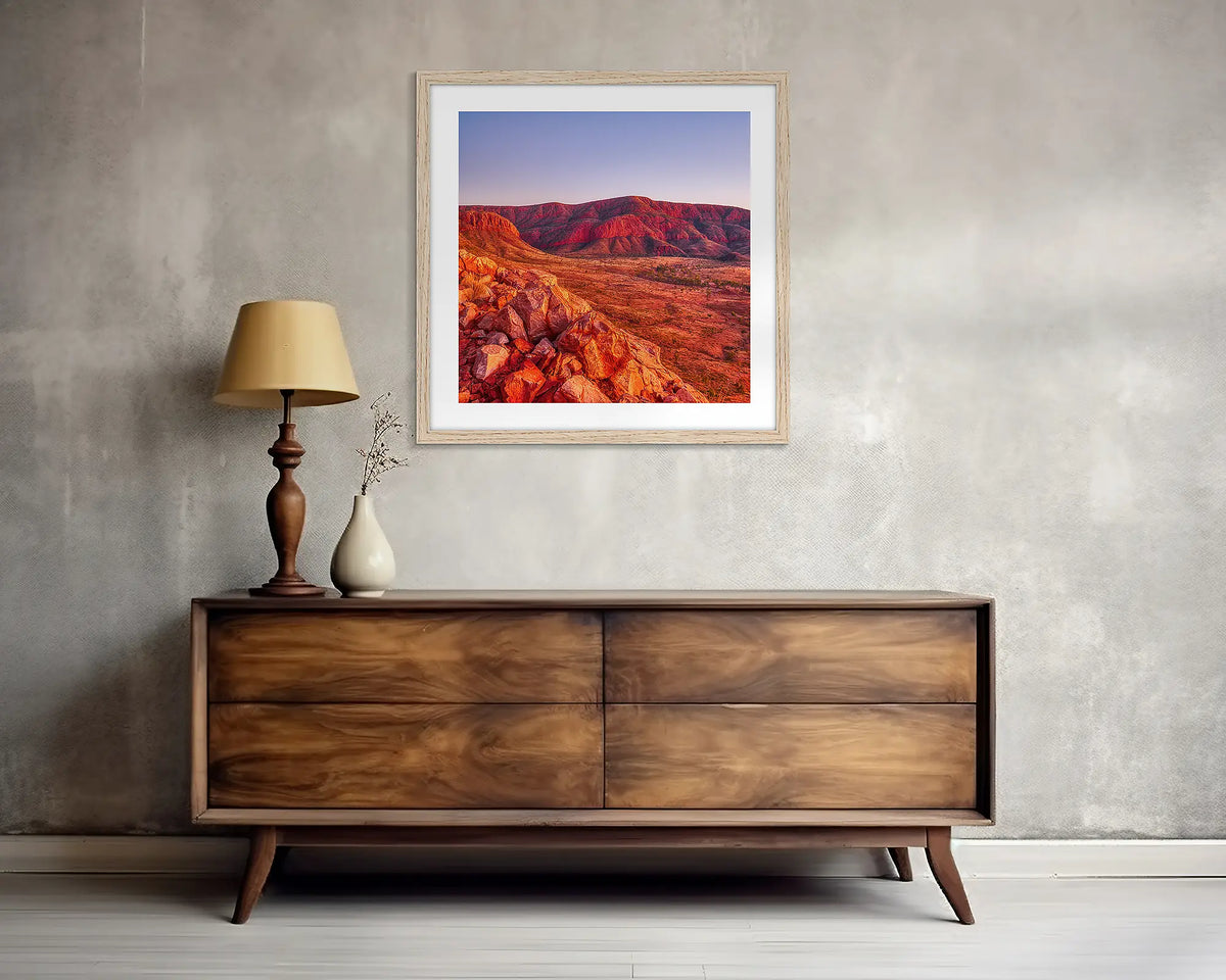 Ancient Dawn. Square, outback wall art print, with a Tassie oak frame, above a side table. 