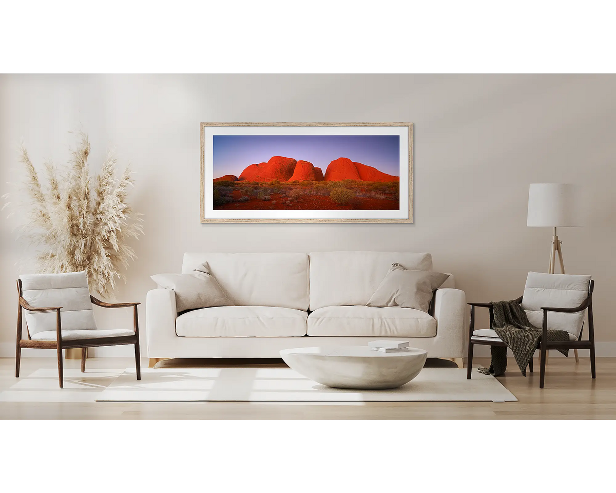 Ancient Land. Outback artwork, in a Tassie Oak frame, above a couch. 