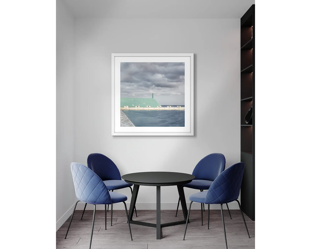 Angles. Newcastle baths, framed wall art with a white frame, in an office meeting room. 