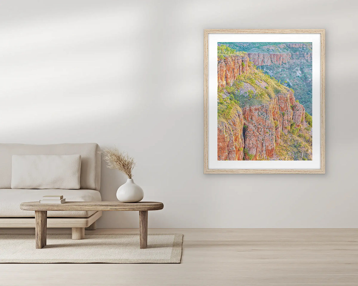 Ascension. Extra large wall art print, with a Tassie oak frame, in a living room. 