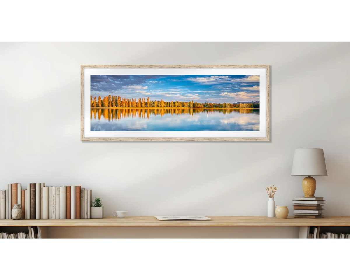 Autumn By The Lake. Wall art print, with a timber frame, above a desk. 