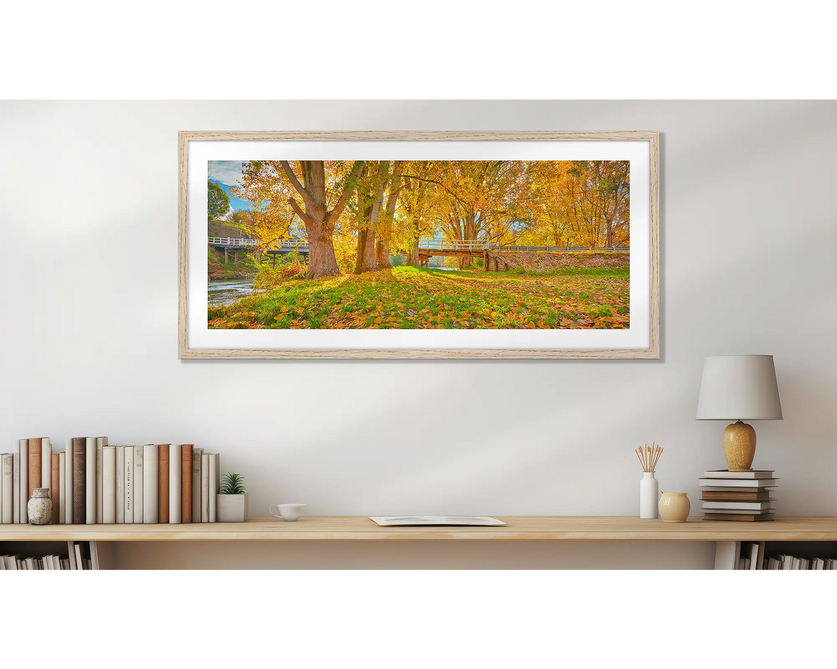 Autumn By The Murray. Wall art print, with a timber frame, above a desk. 