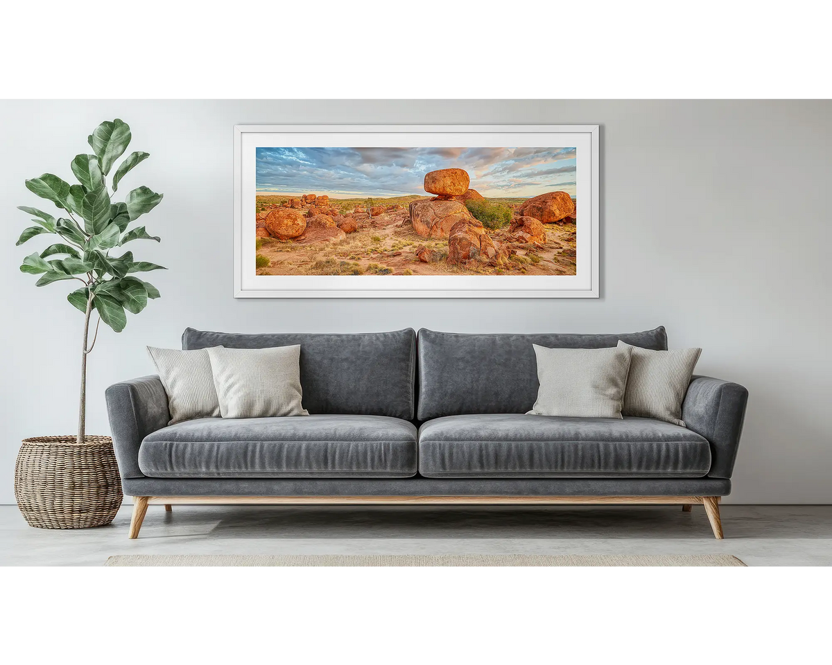 Balanced. Devils Marbles framed wall art, hanging above a couch. 