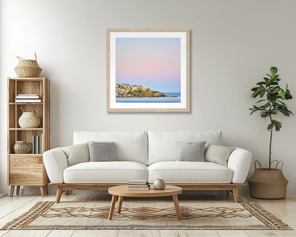 Bondi Heights. Sydney wall art print, with a Tassie oak frame, above a couch. 