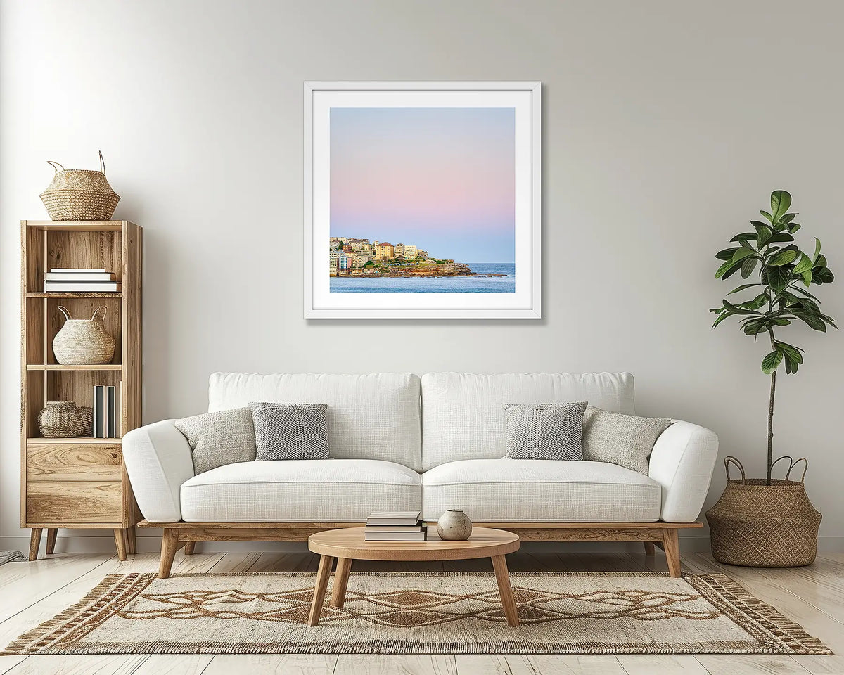 Bondi Heights. Sydney wall art print, with a white frame, above a couch. 