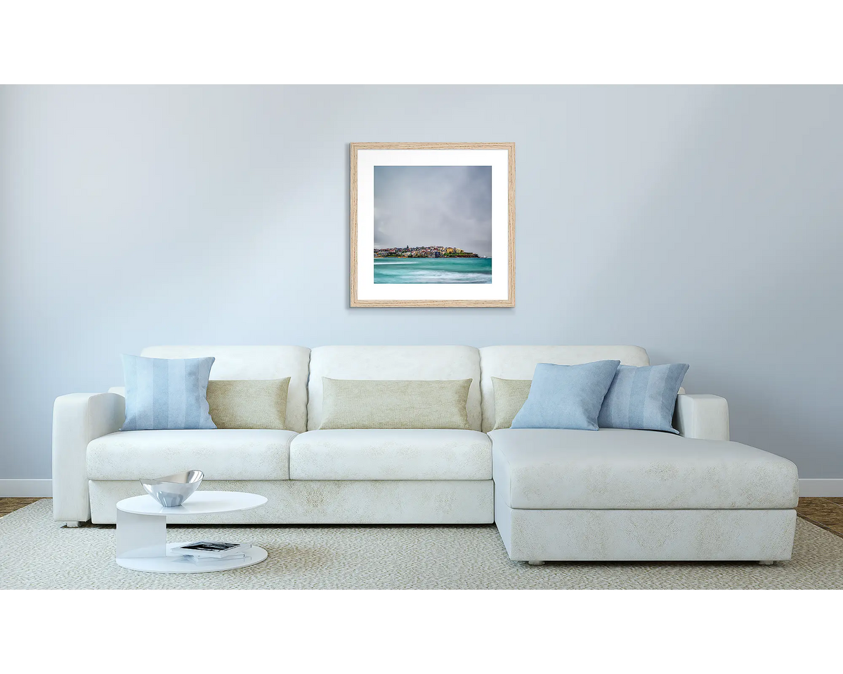 Bondi Views. Sydney artwork in a Tasmanian Oak frame, above a couch.