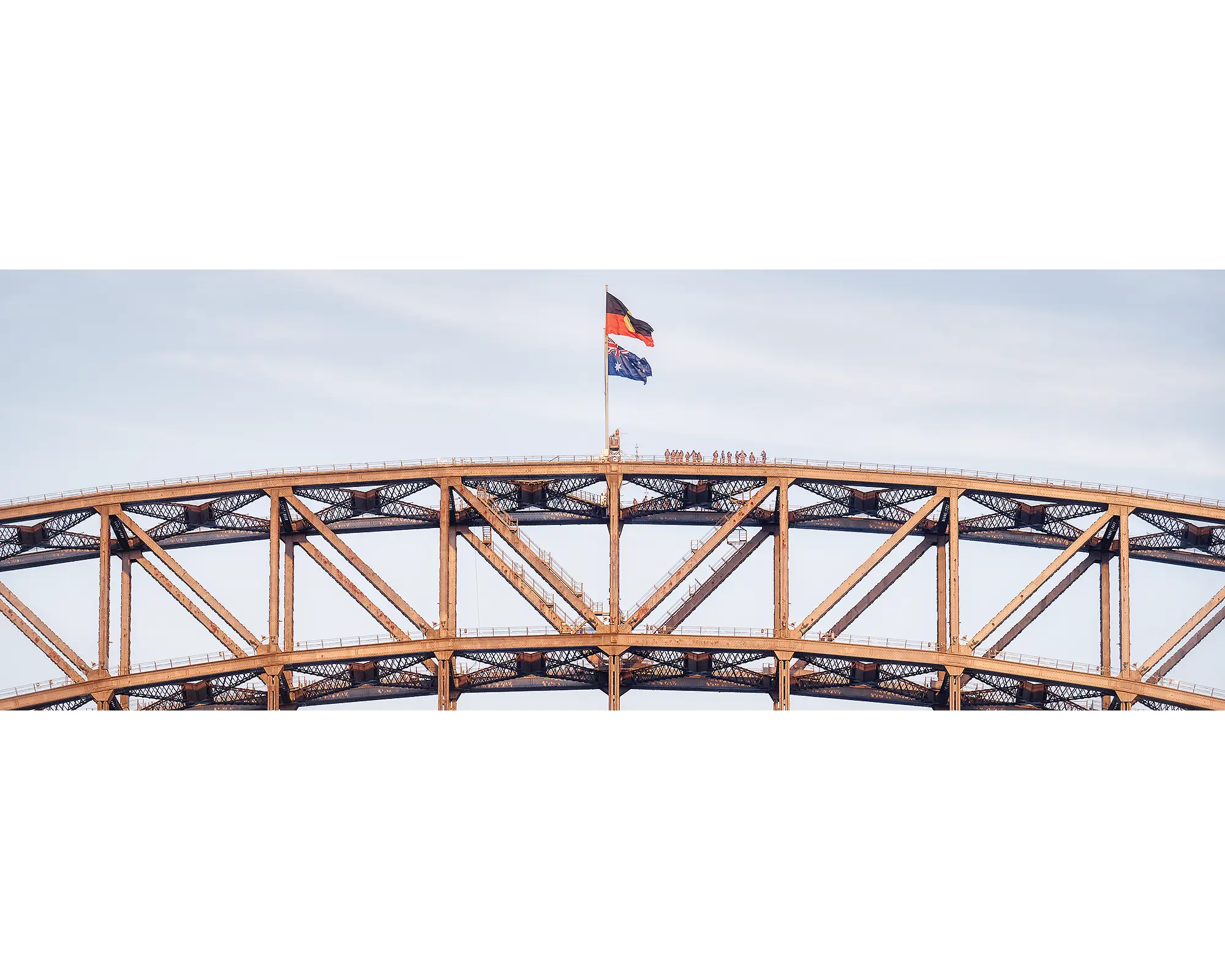 Bridge Climb. People on top of Sydney Harbour Bridge at sunset.