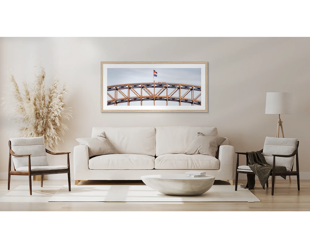 Bridge Climb. Sydney Harbour Bridge wall art, with a Tassie oak frame, above a couch. 