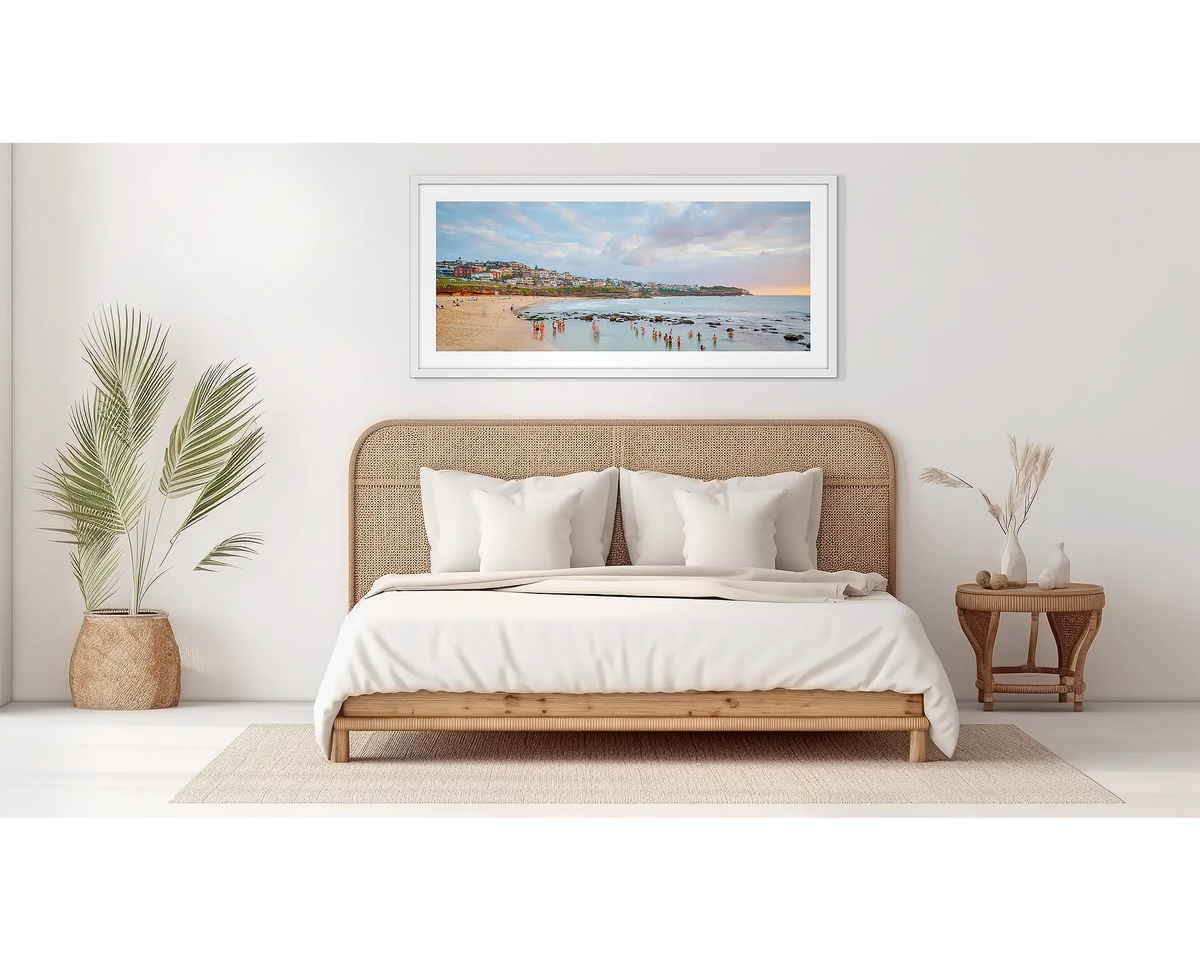 Bronte Gathering. Bronte beach wall art in a white frame, on a bedroom wall. 