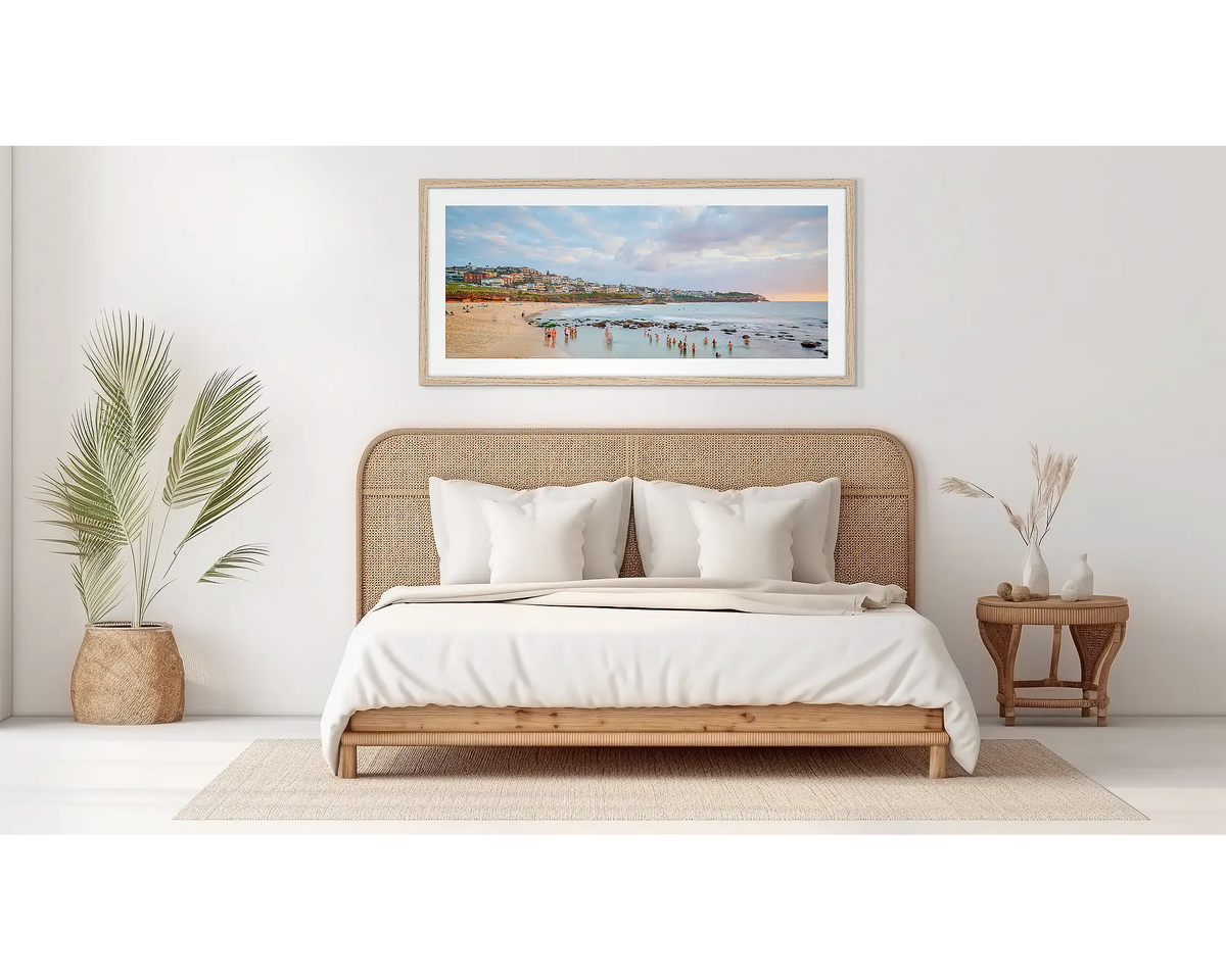 Bronte Gathering. Bronte beach wall art in a wood frame, on a bedroom wall. 