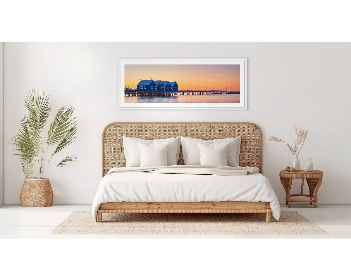 Busselton Sunset. Busselton Jetty wall at in a white frame, on a bedroom wall. 