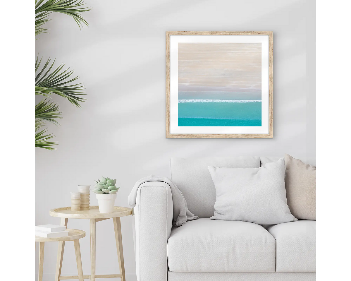 Cable Calm. Framed Kimberley wall art print, with a timber frame, hung above a couch.