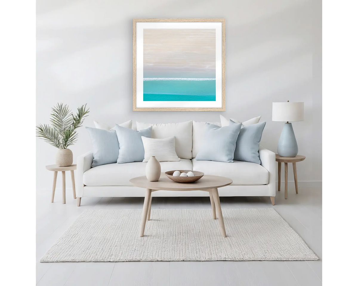 Cable Calm. Kimberley coastal wall art, framed in a Tasmanian Oak frame, hanging above a couch.