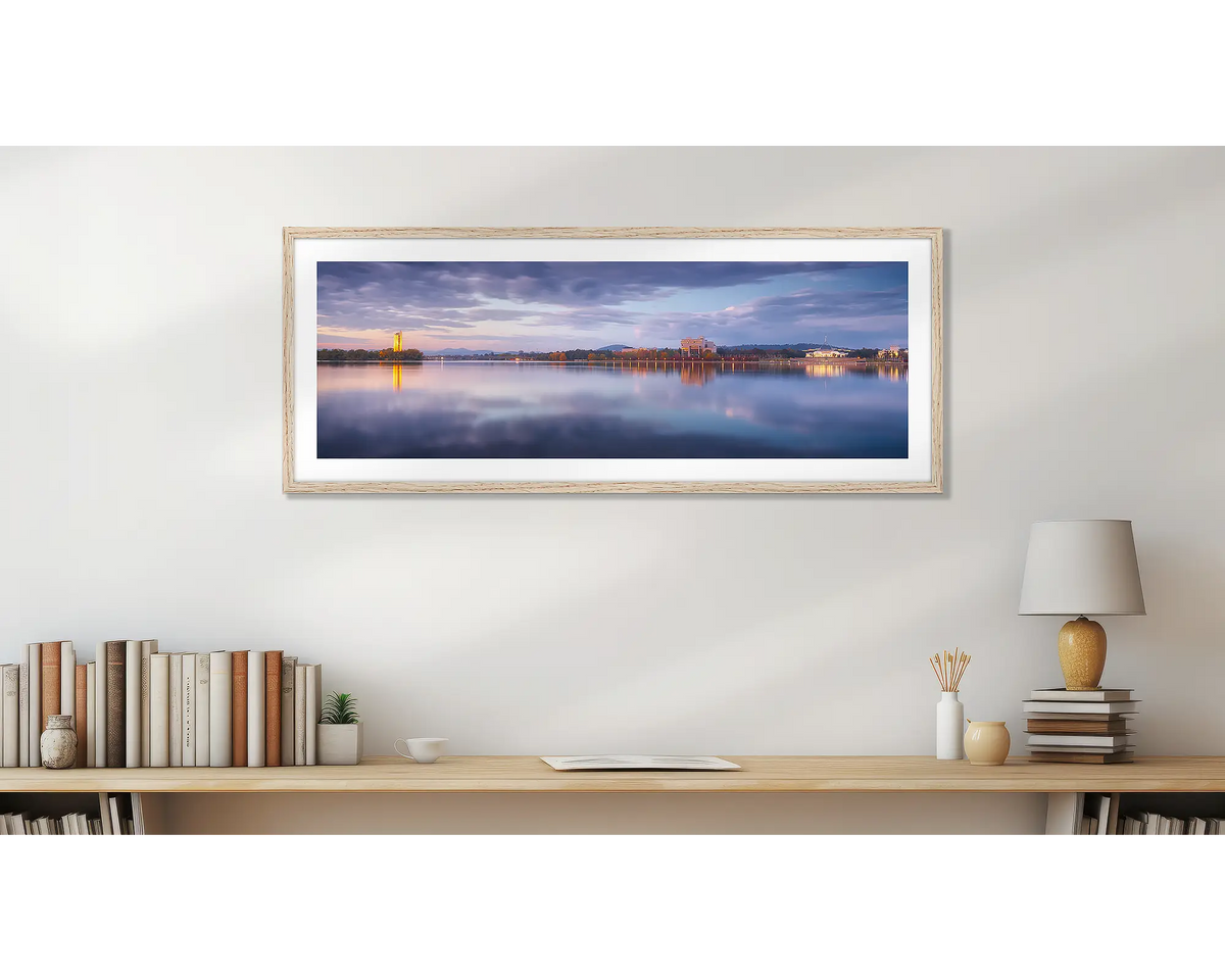 Canberra Morning. Sunrise over Lake Burley Griffin, wall art print, with a timber frame, above a desk. 