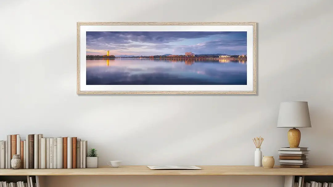 Canberra wall art print with timber frame above desk.