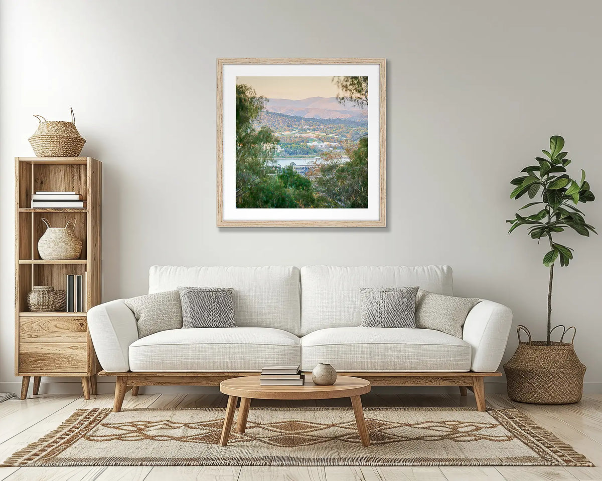 Capital View. Canberra wall art print, with a timber frame, in a lounge room. 