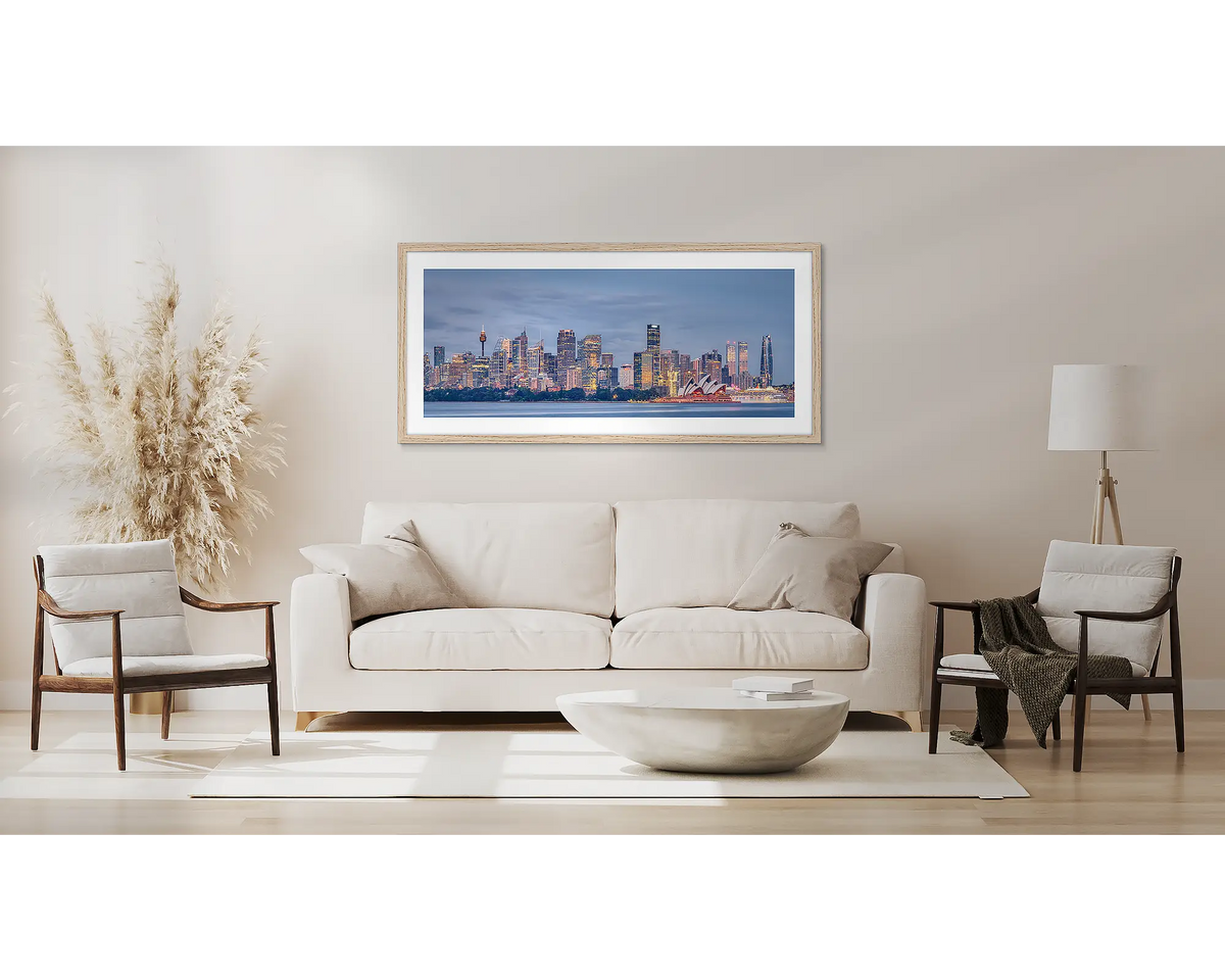 City Lights. Sydney wall art, with a Tassie oak frame, above a couch.