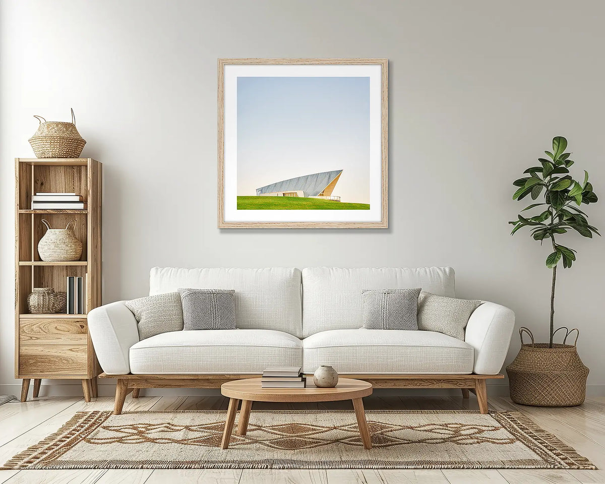 Clarity. Canberra wall art print, with a Tassie oak frame, above a couch. 