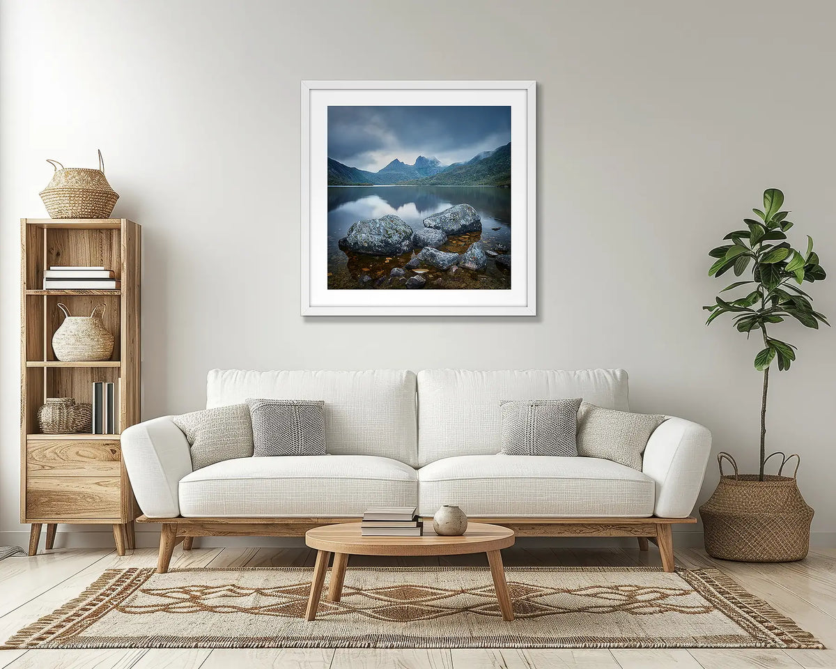 Classic Cradle. Tasmanian wall art print, with a white frame, above a couch. 