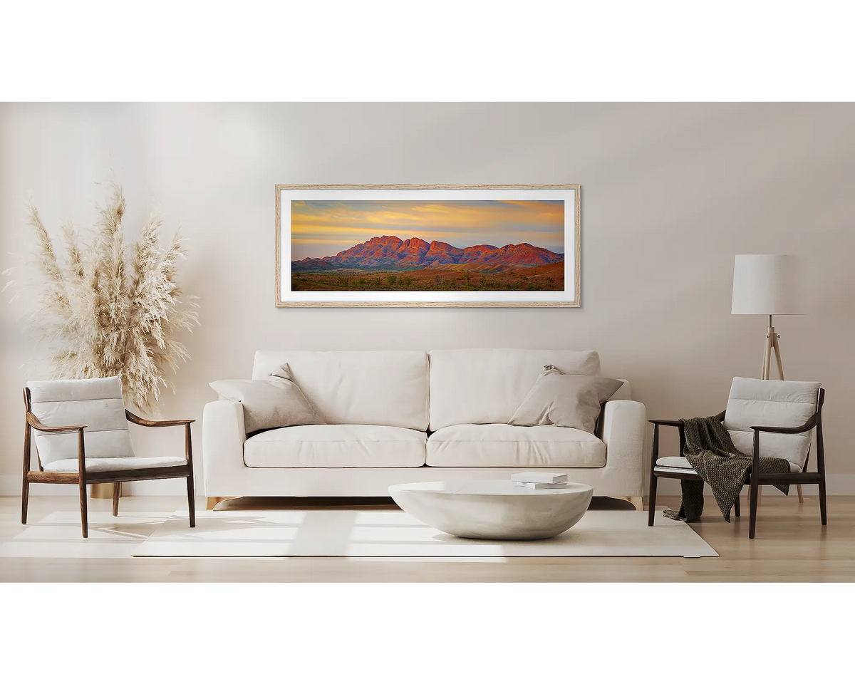 Classic Flinders. Wall art print of Flinders Ranges, with a Tassie oak frame, above a couch. 