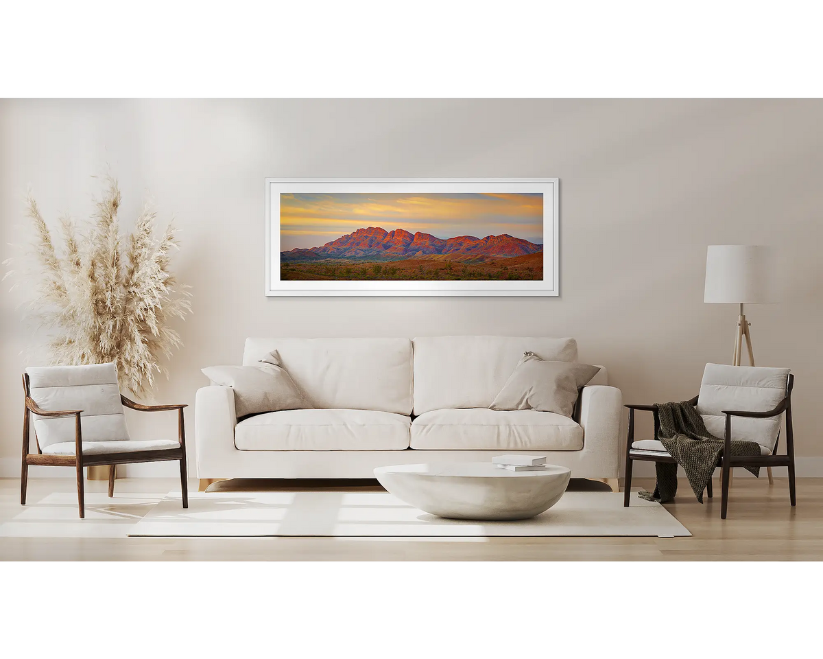 Classic Flinders. Wall art print of Flinders Ranges, with a white frame, above a couch. 