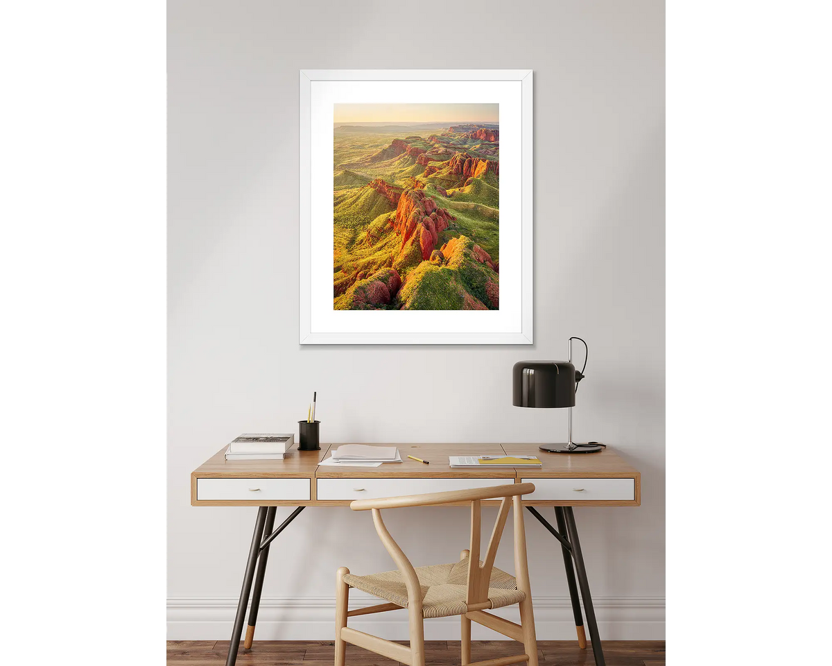 Classic Kimberley wall art print with a white frame, hanging above a desk.