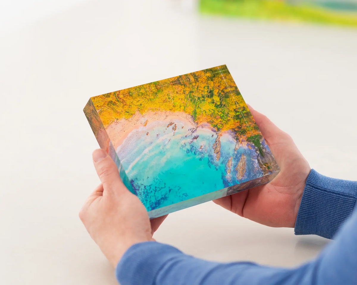 Coastal Bliss. Acrylic block of a sunrise at Lilli Pilli beach. Australian Artwork being held.