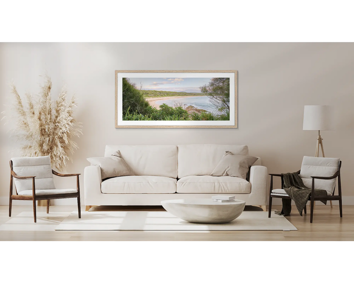 Coastal Retreat. South coast wall art, with a Tasmanian oak frame, above a couch. 