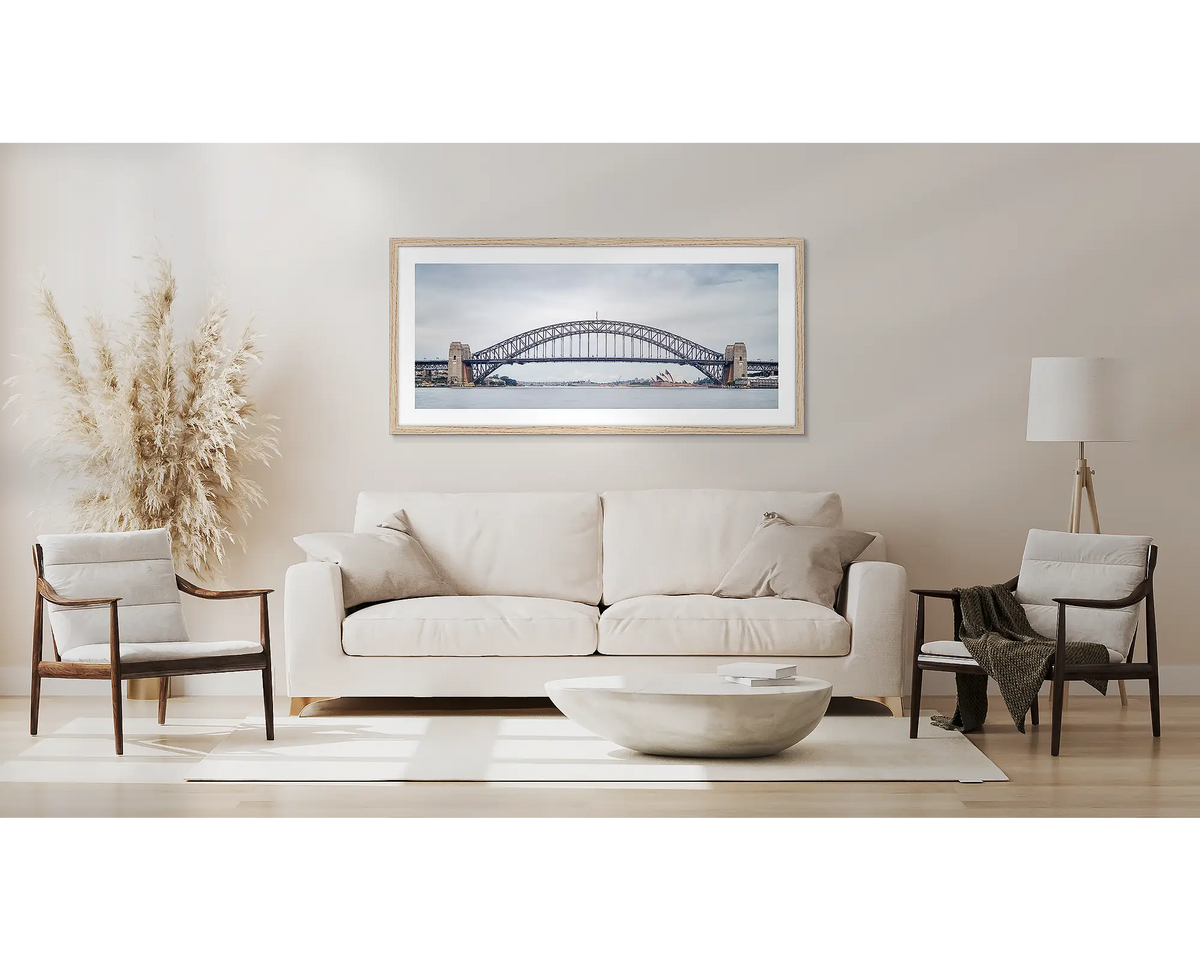 Coat Hanger. Sydney Harbour Bridge wall art, with a Tasmanian oak frame, above a couch. 