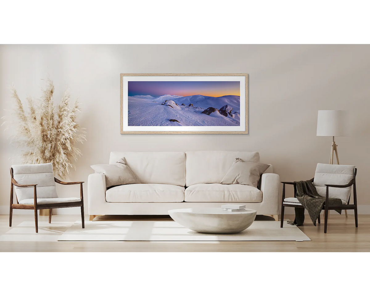 Cold and Alone. Winter snow wall art, with a Tasmanian oak frame, above a couch. 