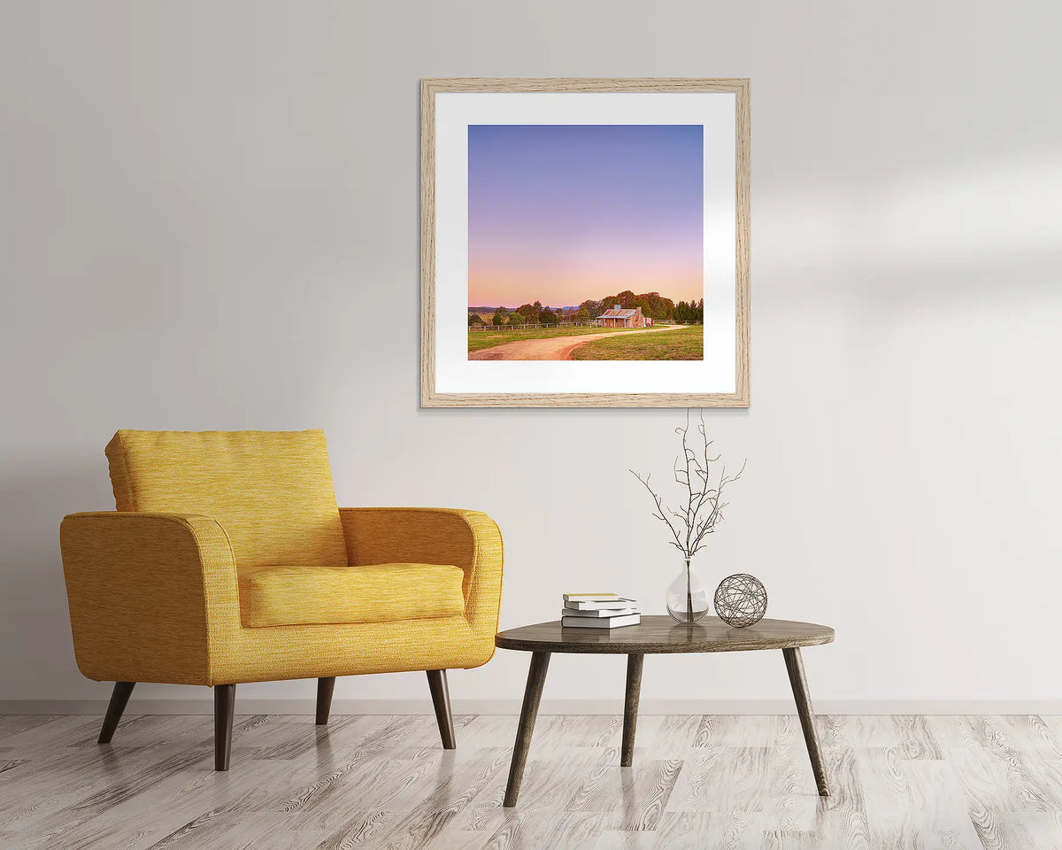 Country Charm. Rural artwork in a Tasmanian Oak frame, hanging above  a chair.