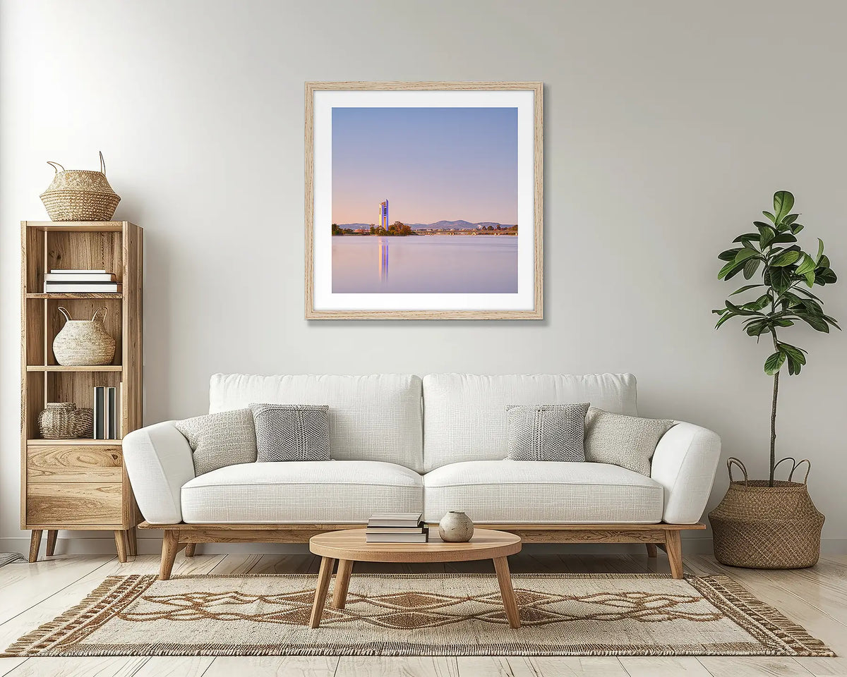 Crisp. Canberra Carillon wall art print, with a timber frame, above a couch. 