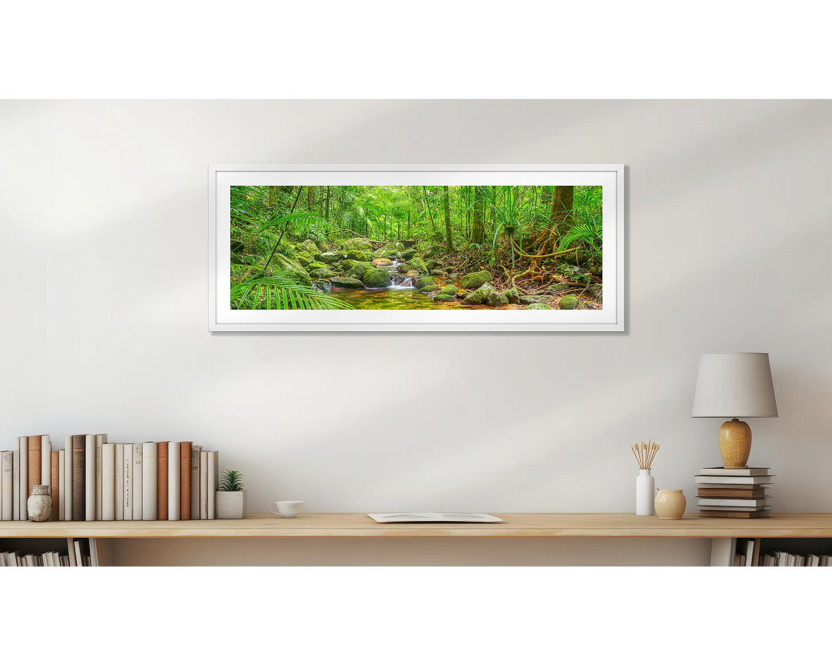 Daintree Tranquility. Panoramic wall art print, with a white frame, on a study wall. 