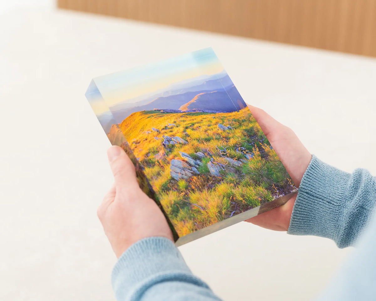 Days End. Acrylic block of Alpine National park at sunset. Australia artwork being held.