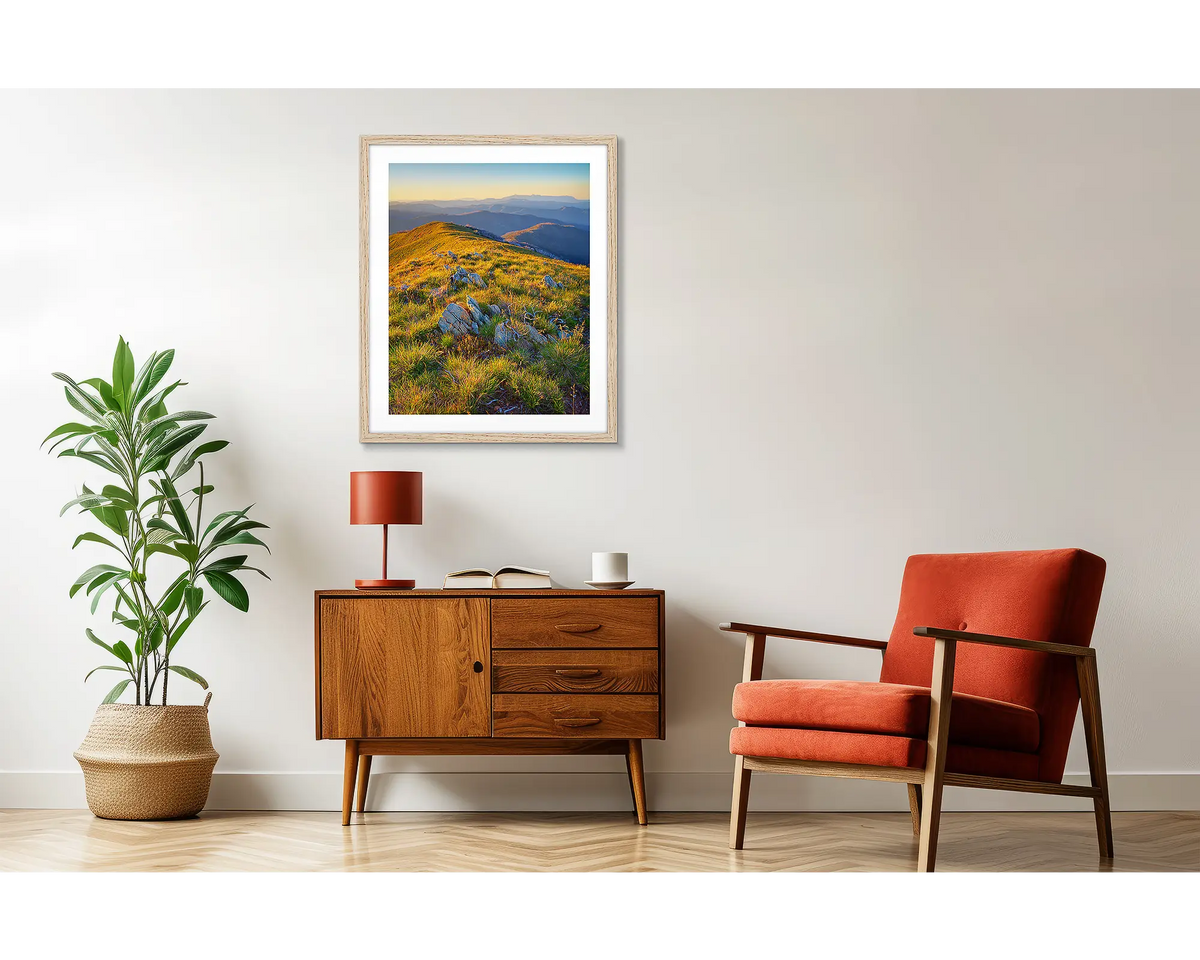 Days End. Victorian high country wall art, in a wood frame, above a side table. 