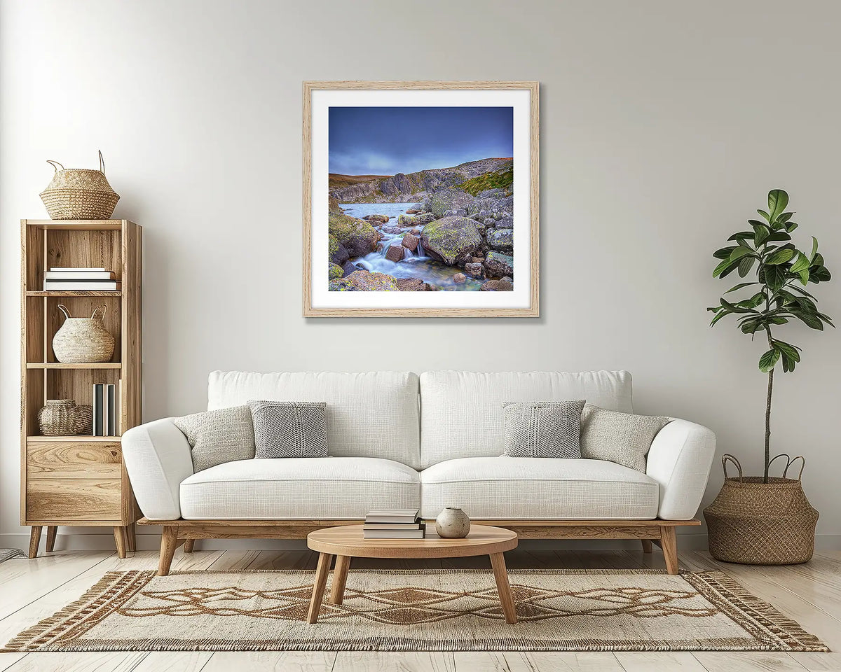 Deep Blue. Snowy mountains wall art print, with a timber frame, in a lounge room. 