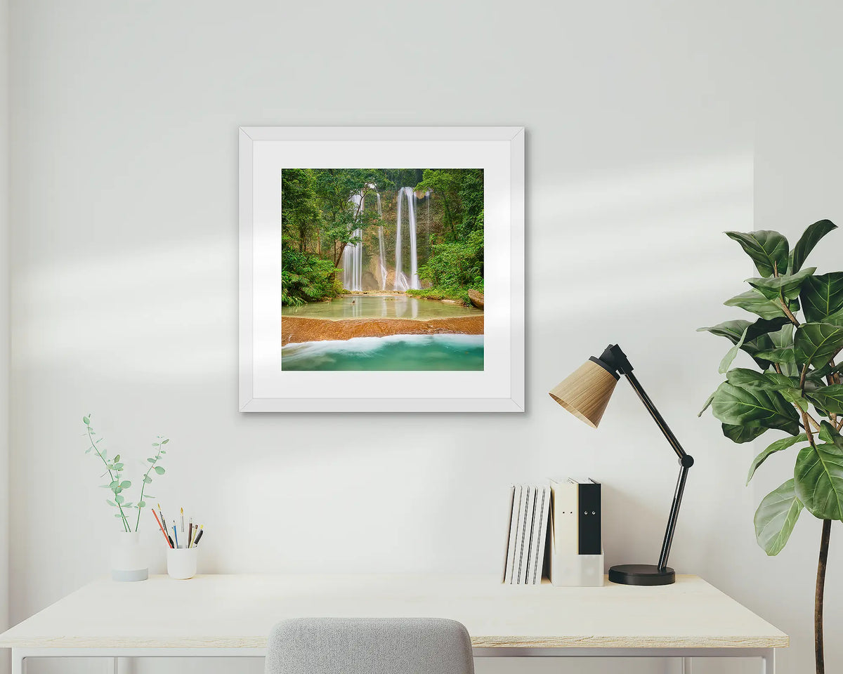 Discovery. Tenaru Falls, waterfall artwork, with white frame, on a study wall. 