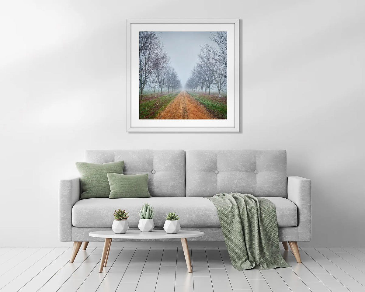 Down the Road. Framed country wall art above a couch. 