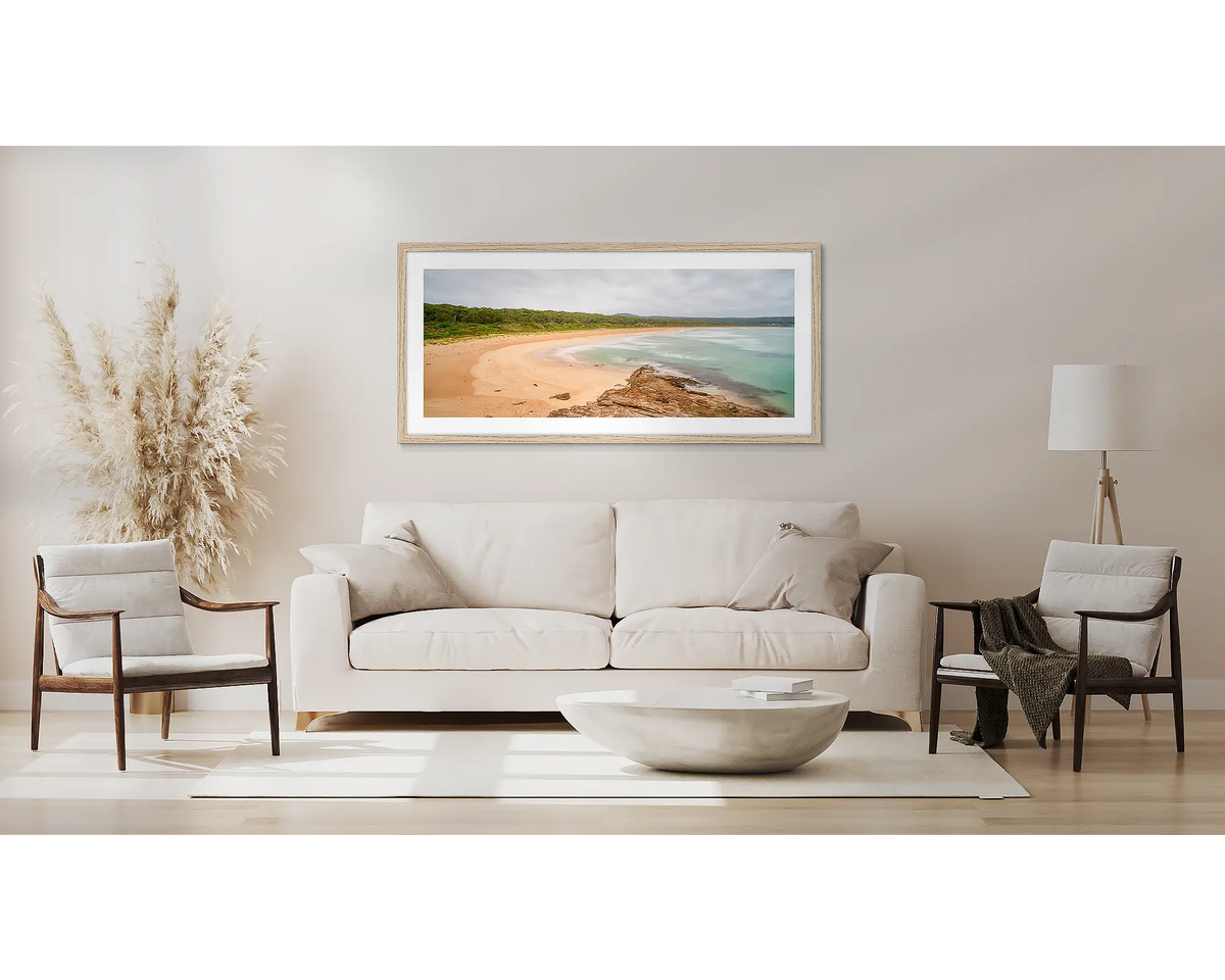 Durras Calm. South coast wall art print, with a Tasmanian Oak frame, above a couch. 