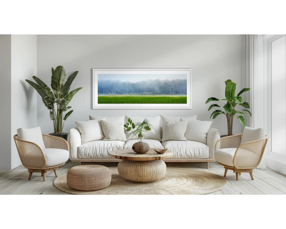 Edge of Wilderness. Tasmanian wall art print, in a white frame, above a couch. 