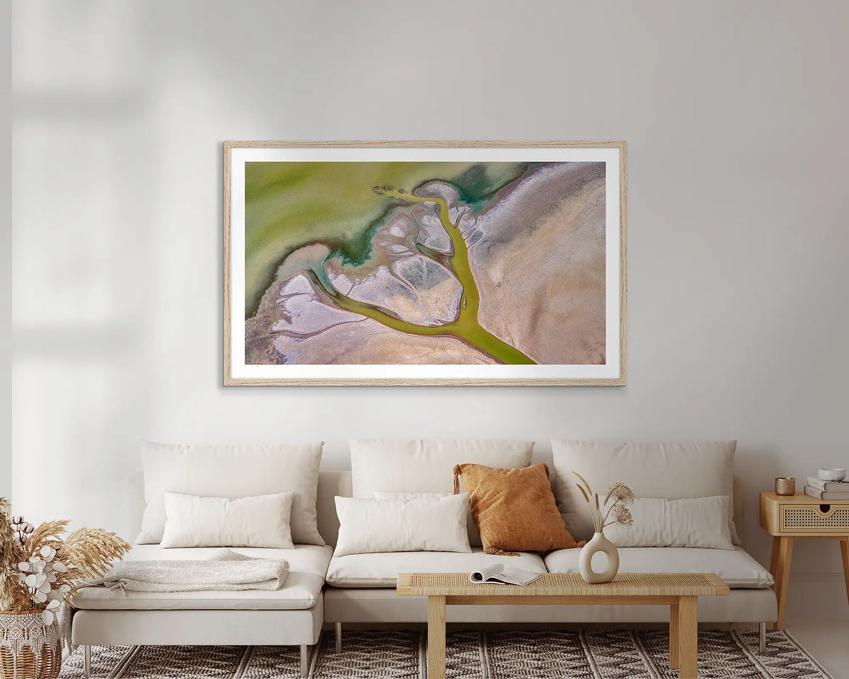 Embrace. Abstract Kimberley wall art print, with a timber frame, on a lounge room wall. 