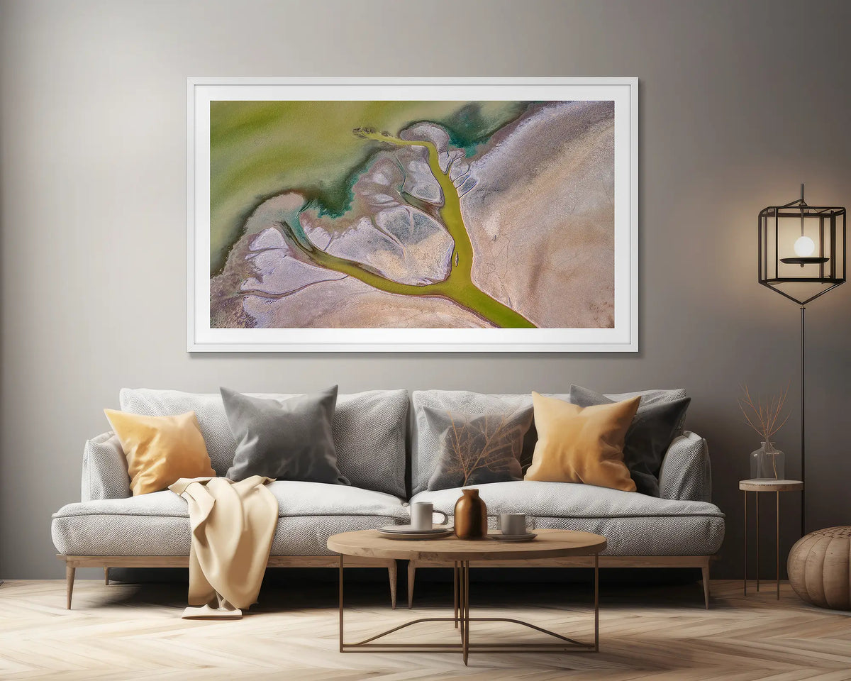 Embrace. Extra large, abstract wall art print, with a white frame, on a lounge room wall. 