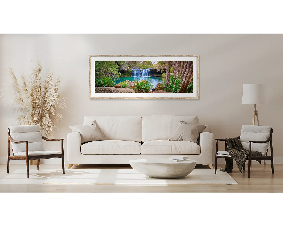 Emerge. Waterfall wall art in a Tasmanian Oak frame, in a lounge room. 