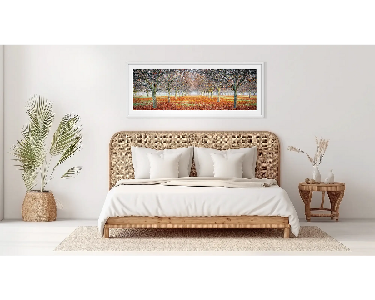 Emergent. Orchard artwork, in a white frame on a bedroom wall. 