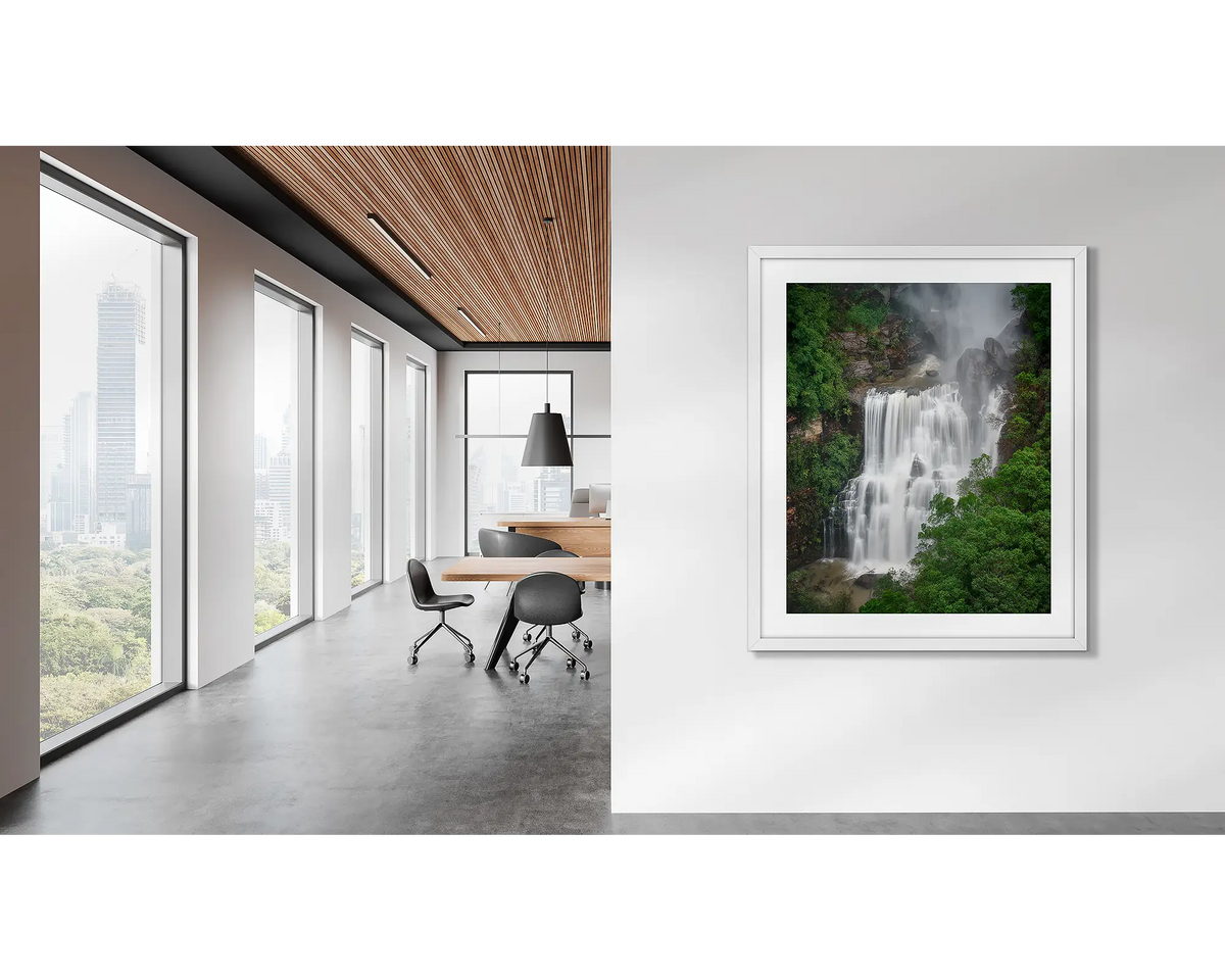 Energy. Waterfall wall art, in a white frame, on an office wall. 