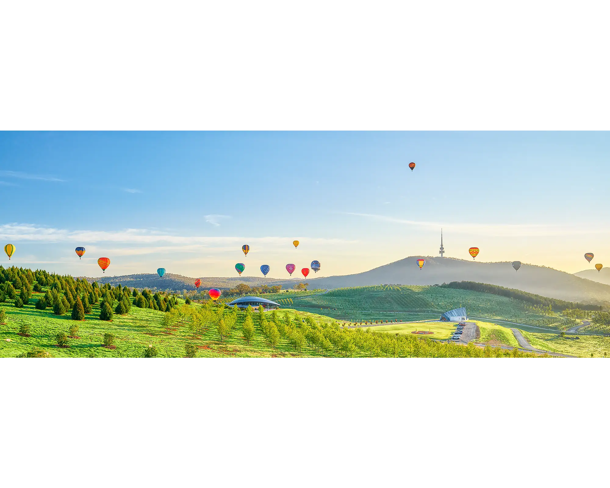 Enlighten. Hot air balloons over Canberra at sunrise.